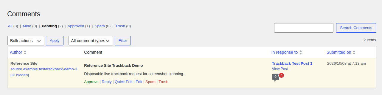 WordPress pending moderation queue showing a trackback-like item with Approve, Spam, and Trash actions